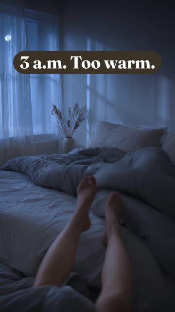 A vertical ad: a dim bedroom in cold blue moonlight, a heavy grey duvet kicked half off the bed, with the words “3 a.m. Too warm.”